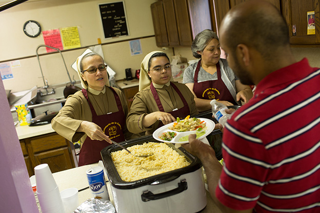 Catholic sisters serve a meal in Kalamazoo