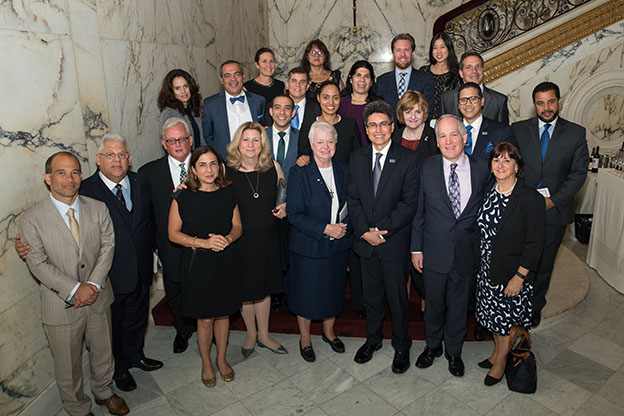 Mario Paredes, second from left, and colleagues attend Catholic Extension Society’s Spirit of Francis Award dinner in New York City.