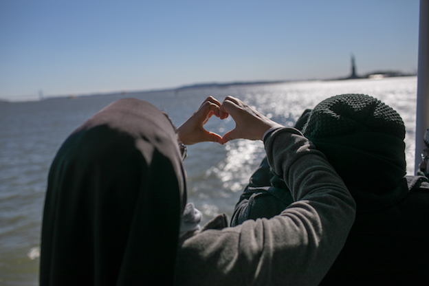 Catholic sister showing heart shape 