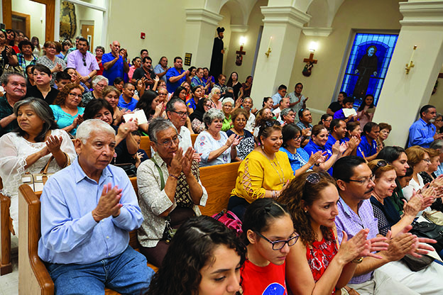 Latinos filling the pews of a church