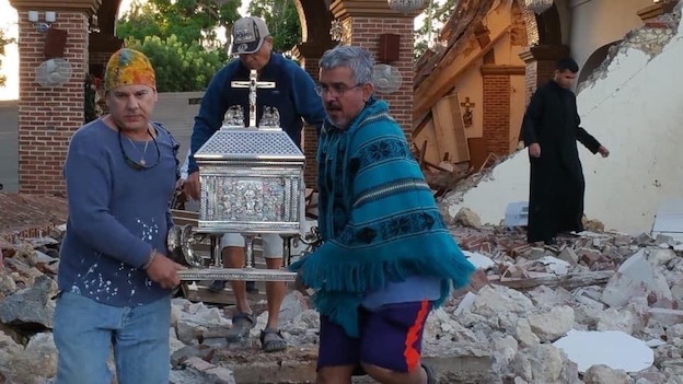 Men carry tabernacle at Immaculate Conception Parish after Puerto Rico Earthquake