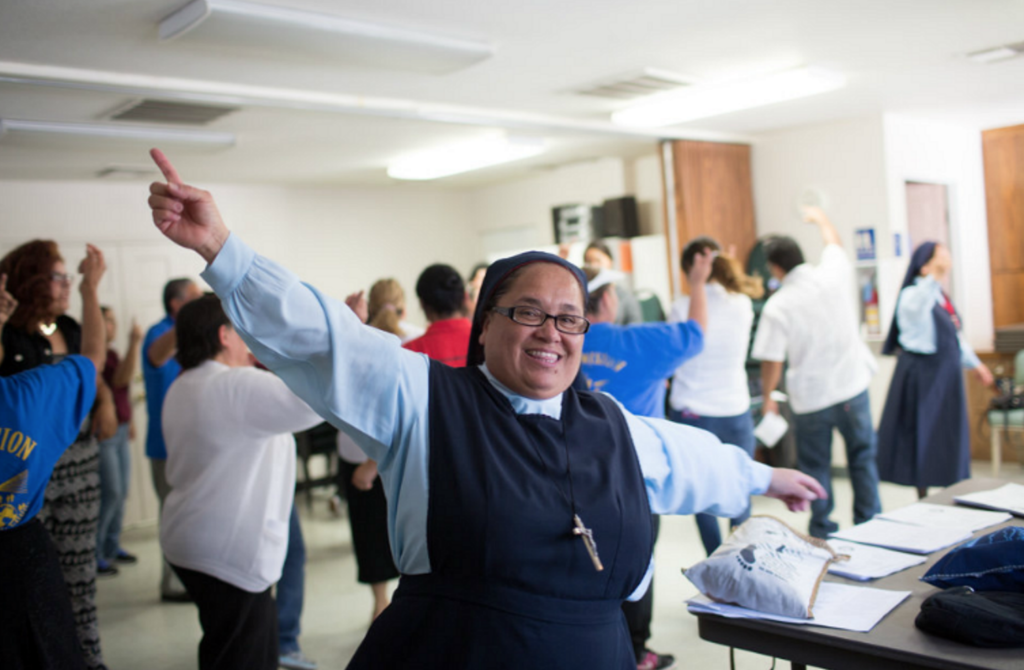 Sr Rosario dances in a parish building