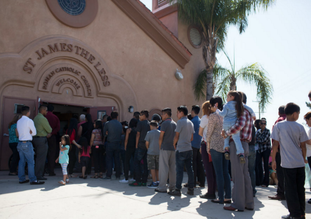 Parishioners line up outside of church during Mass