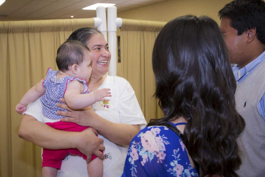 Dr. Olga Lucia Villar holds a baby