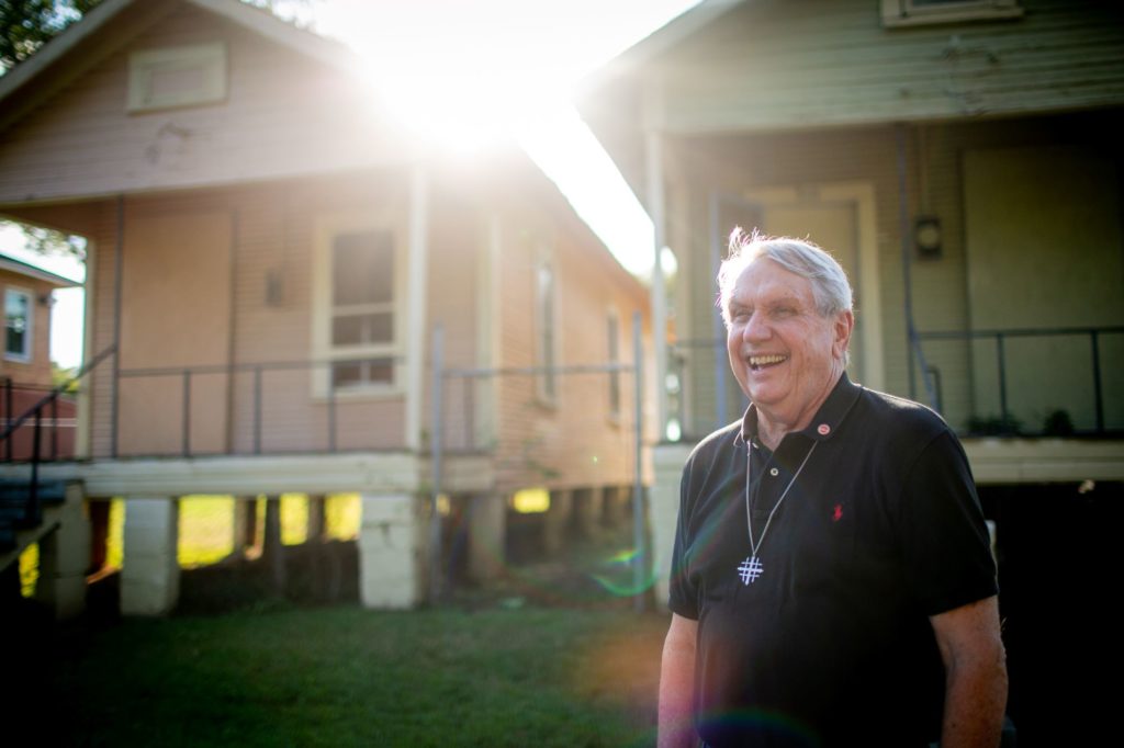 Mack McCarter in front of houses in Shreveport