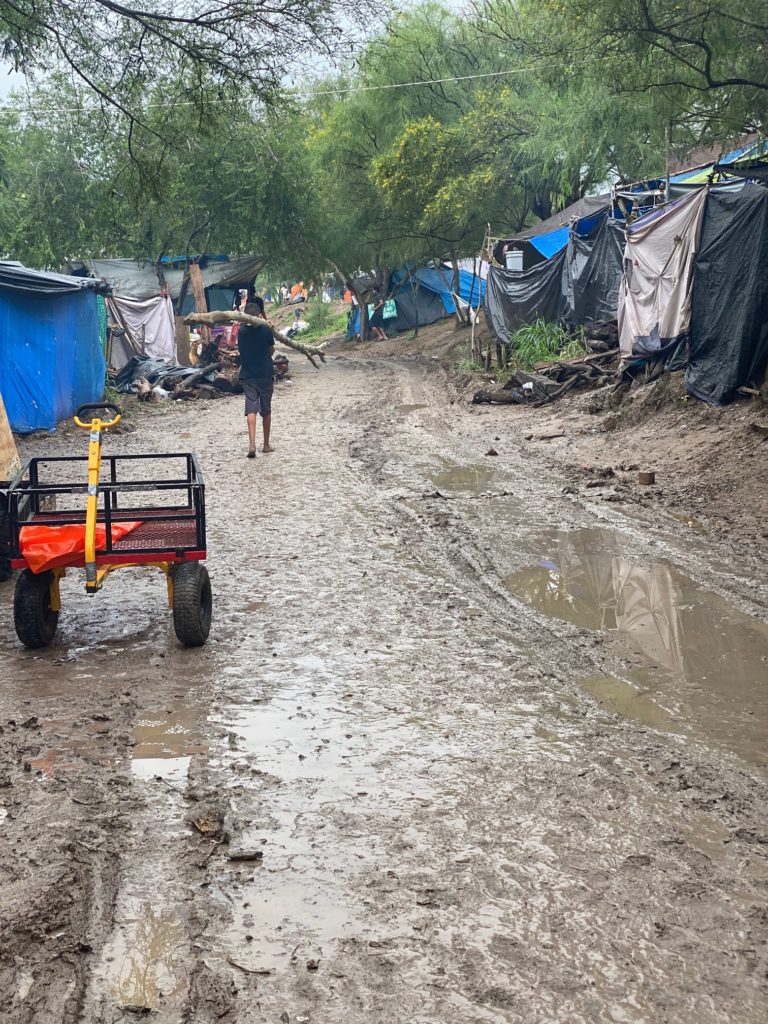 Immigrant tent city after Hurricane Hanna