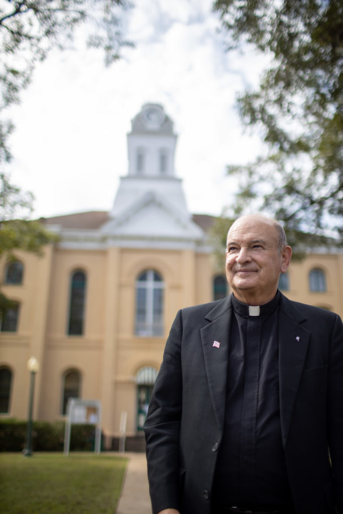 Father Foshage in front of courthouse