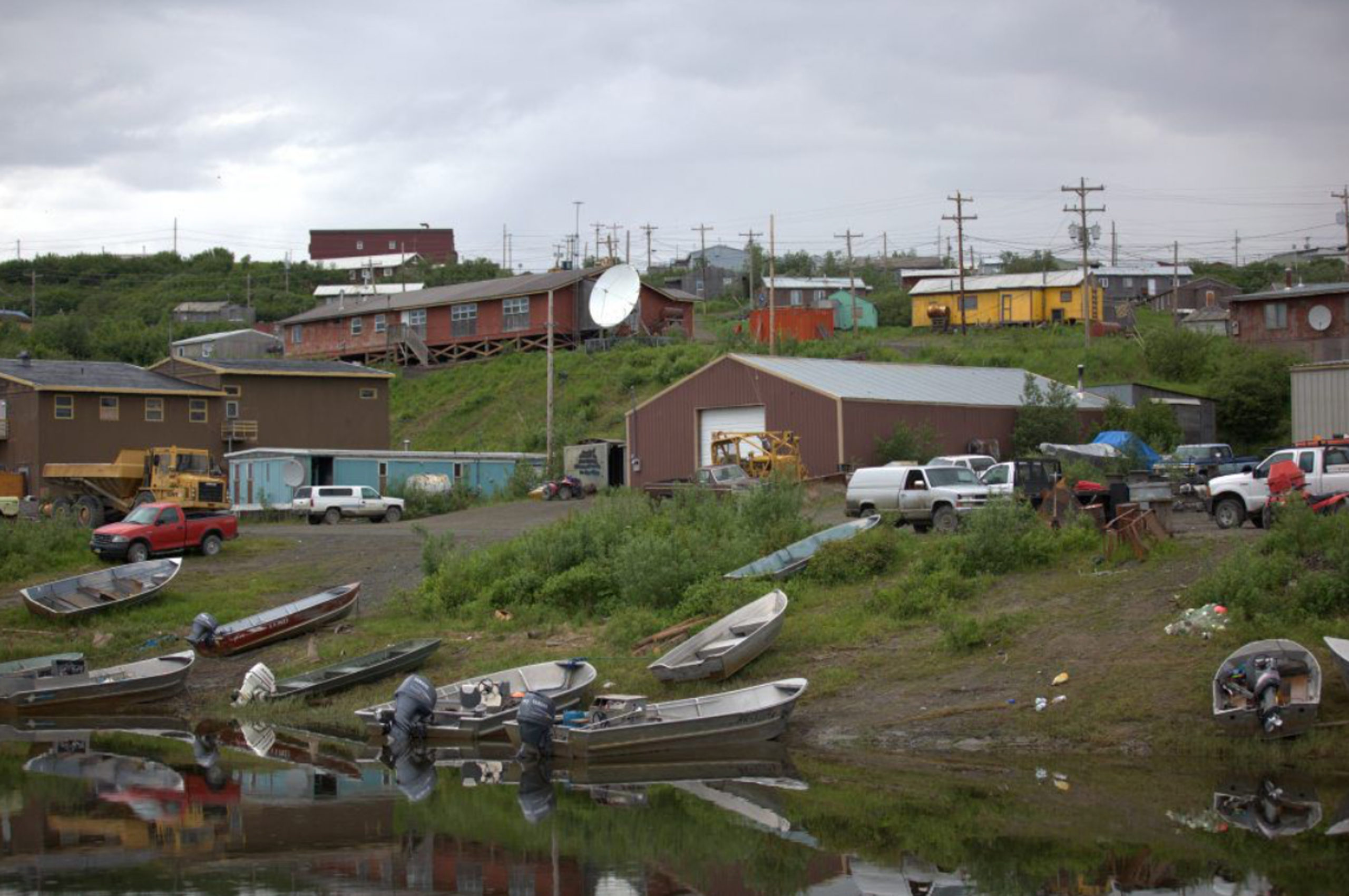 Empty boats line the shore.