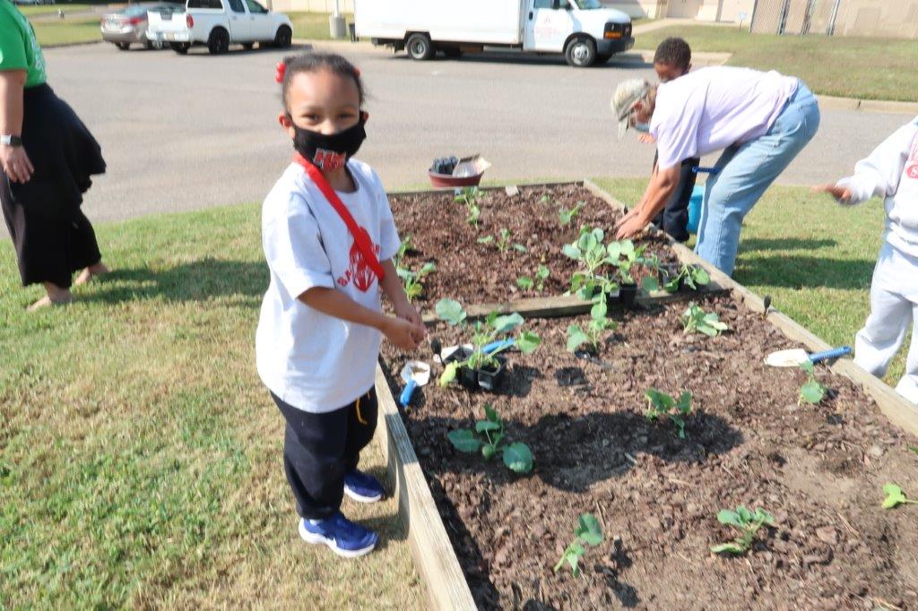 Child planting garden 